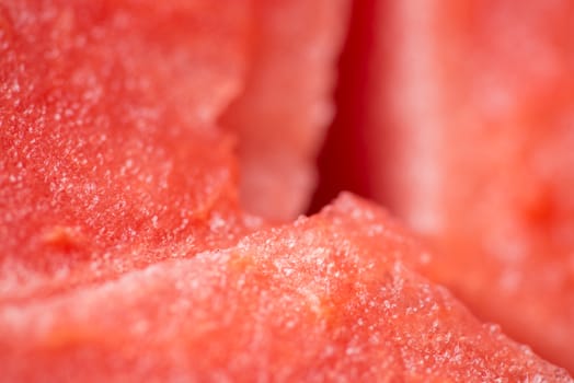 ripe watermelon flesh closeup macro texture background.