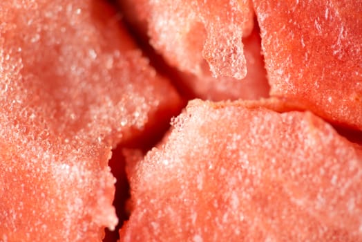 ripe watermelon flesh closeup macro texture background.