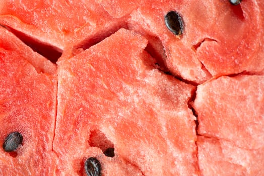 ripe watermelon flesh closeup macro texture background.