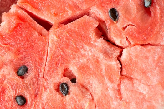 ripe watermelon flesh closeup macro texture background.