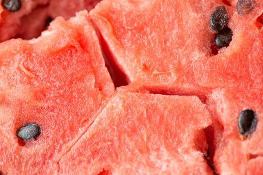 ripe watermelon flesh closeup macro texture background.