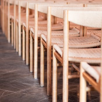 Rows of seats inside an empty church, selective focus
