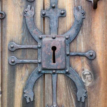 Keyhole of old doorlock in a wooden door