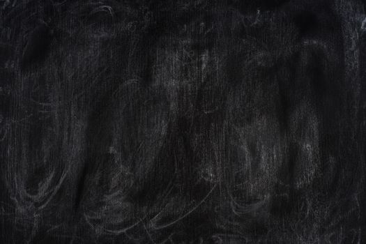 Chalk rubbed out on blackboard. Abstract background, empty template.