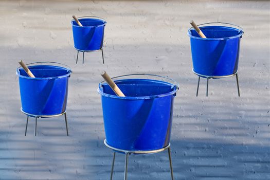 Windows cleaning water in blue plastic buckets. Background with water drops.