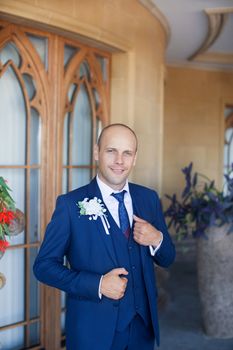 Happy man in a summer wedding day