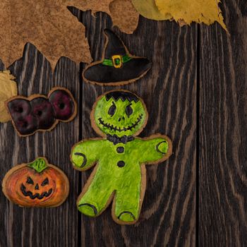 Homemade delicious ginger biscuits for Halloween on wooden table