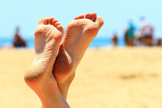 Female feet under the summer sky