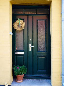 Traditional colorful craft vintage wooden green front door Denmark