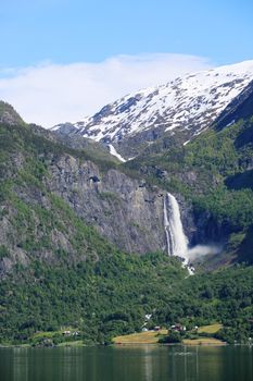 Beautiful landscape with waterfall and mountains in Norway
