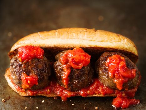 close up of rustic american italian meatball sandwich