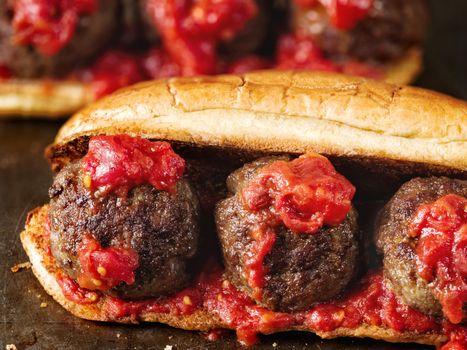 close up of rustic american italian meatball sandwich