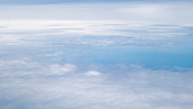 The beautiful cloudy and blue sky (view from airplane).