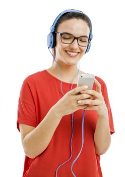 Happy woman listen music on her phone, isolated over white background 