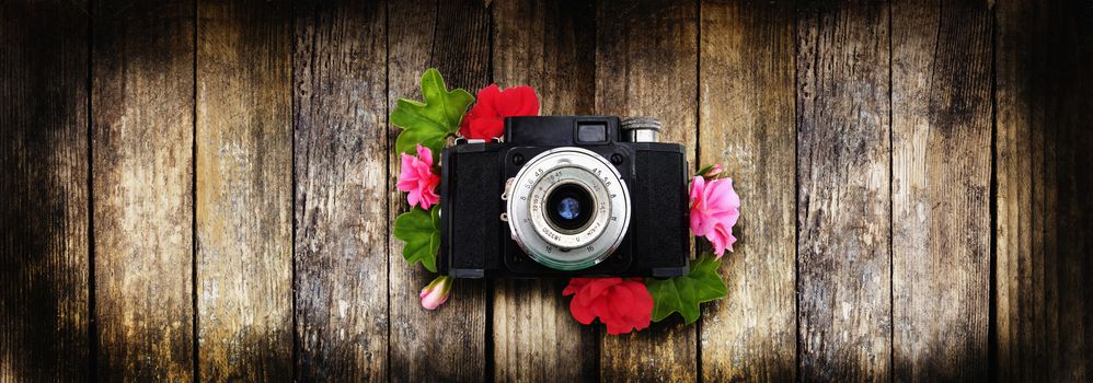 The camera is a rarity to use as a background. Geranium flowers.