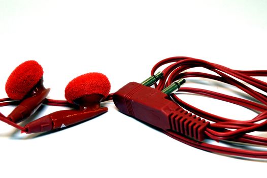 Earphones of red color for portable devices.