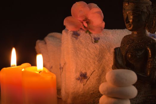 towels and candles for spa, and buddha