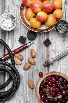Smoking Turkish Shisha and ripe ripe plums