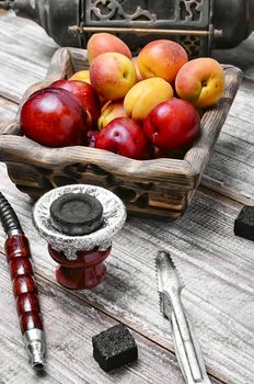 Smoking Turkish Shisha and ripe ripe plums