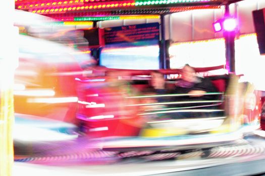 Night colors of the amusement park lights moving, light trails, slow shutter-speed