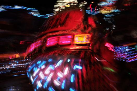 Night colors of the amusement park lights moving, light trails, slow shutter-speed