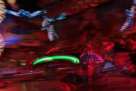 Night colors of the amusement park lights moving, light trails, slow shutter-speed