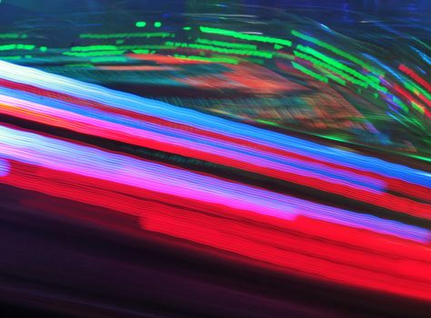 Night colors of the amusement park lights moving, light trails, slow shutter-speed