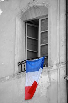  French Flag Hanging on the Window of a Building to Pay Homage to the Victims of Terrorist Attacks in France
