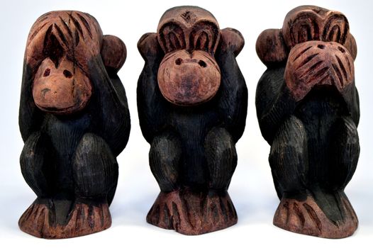 Three wooden monkeys who does not hear, does not see and keep silent about it.