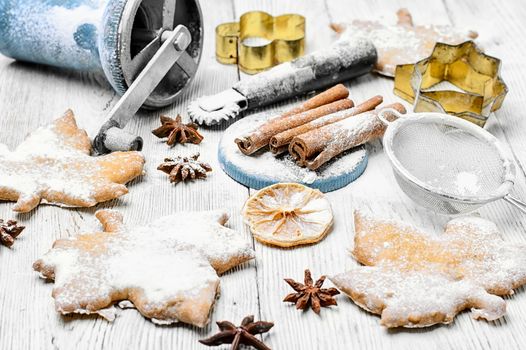 Homemade cookies in the shape of maple leaf on the kitchen table, for the winter holidays