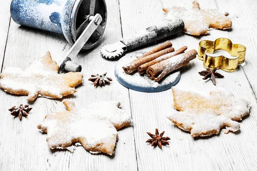 Homemade cookies in the shape of maple leaf on the kitchen table, for the winter holidays