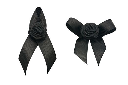 Black awareness ribbon and flower for mourning isolated on white with clipping path