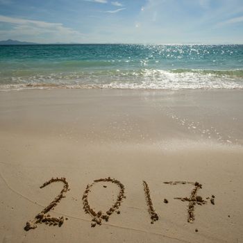 New year 2017 celebration on sea beach concept