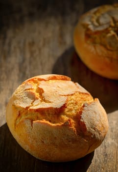 traditional homemade round bread on wooden table