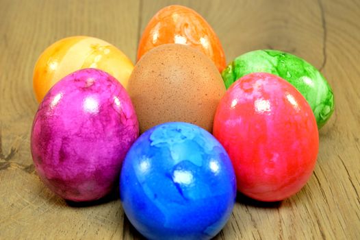 Easter eggs to colorize with a neutral egg on the wood.