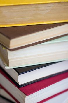 Closeup of stacked old books and textbook