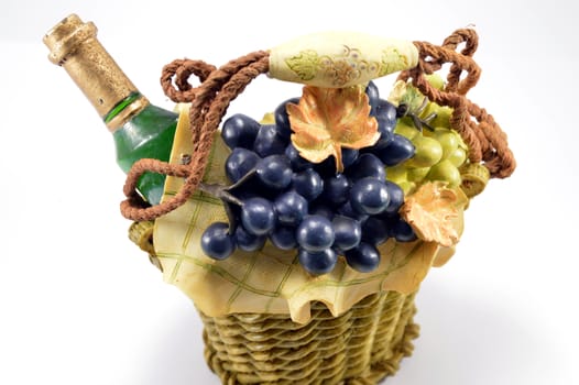 False basket with grapes and wine