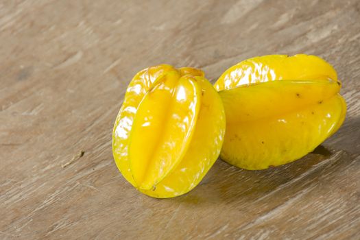 Carambola on wooden table.Fruit for health.Close up.