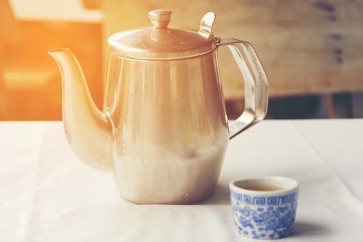 Chinese tea cup and Stainless steel teapot on table for street food of Asia.01