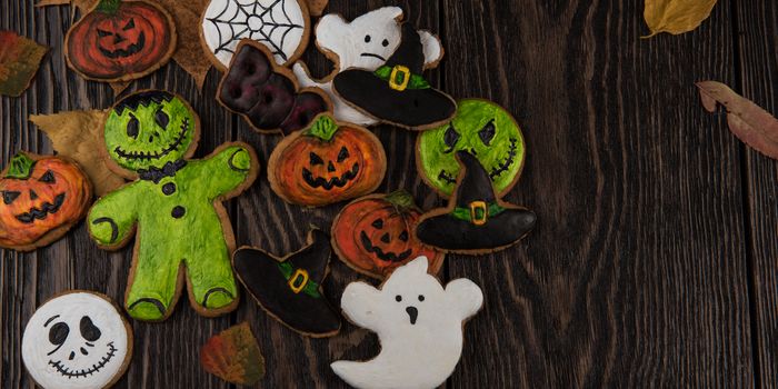 Homemade delicious ginger biscuits for Halloween on wooden table