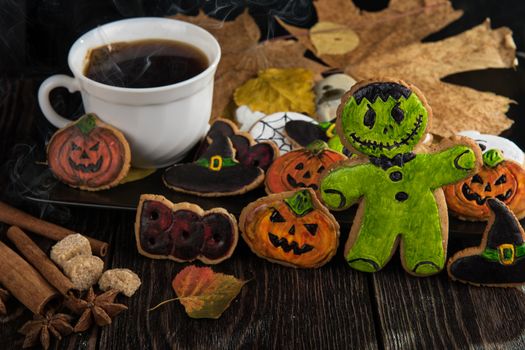 Homemade delicious ginger biscuits for Halloween on wooden table