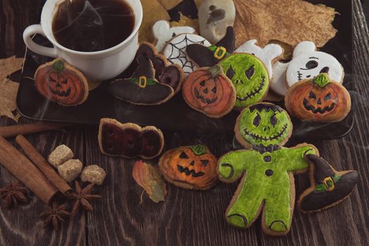 Homemade delicious ginger biscuits for Halloween on wooden table