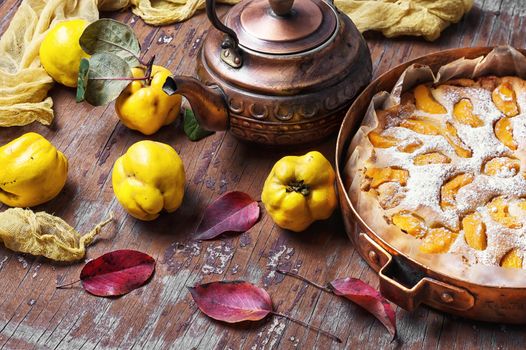 Pie autumn quinces baked in the stylish copper retro form