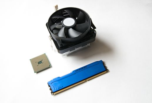 Computer components on a white background. CPU, DDR RAM, Cooler