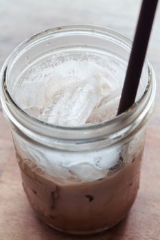 Iced coffee on wooden table, stock photo