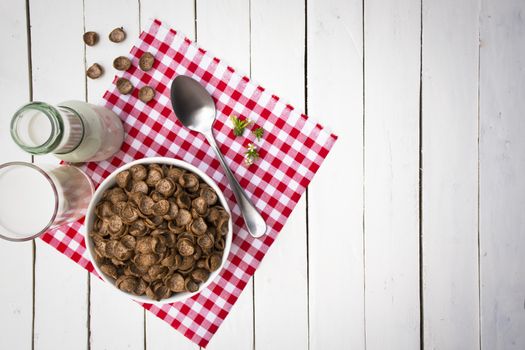 Cereal food and milk bottle and milk glass  on wooden sky blue table.Meal or breakfast hi-vitamin and calcium.