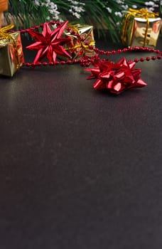 Christmas or New Year dark wooden background, Xmas black board framed with season decorations, space for a text, view from above