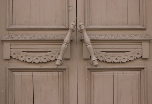old wooden door with a doorknob, close up