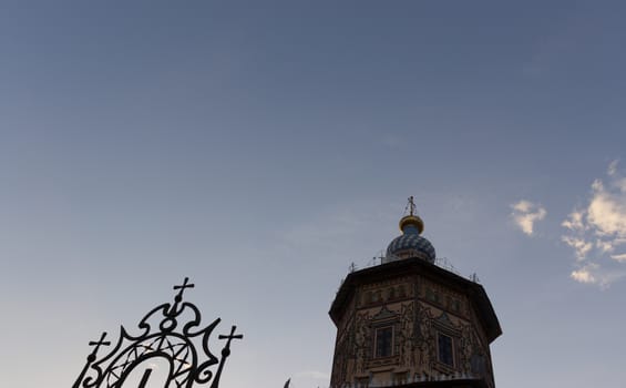 silhouette; of a tower and decorative fence