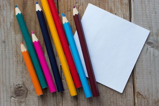 colorful crayons and peace of paper, mock up